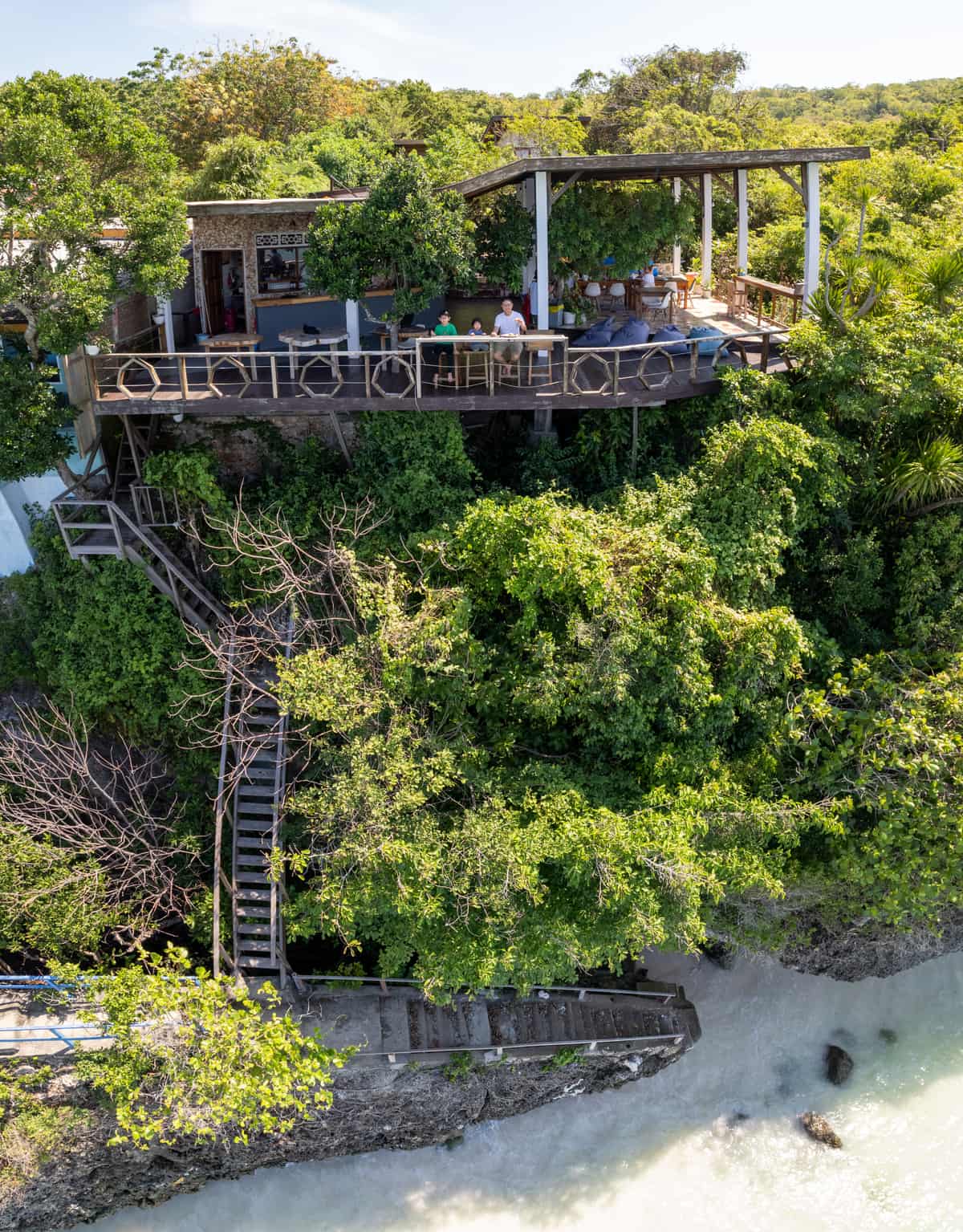 From above: the deck at the top, the wooden stair down the cliff, the sea at the bottom
